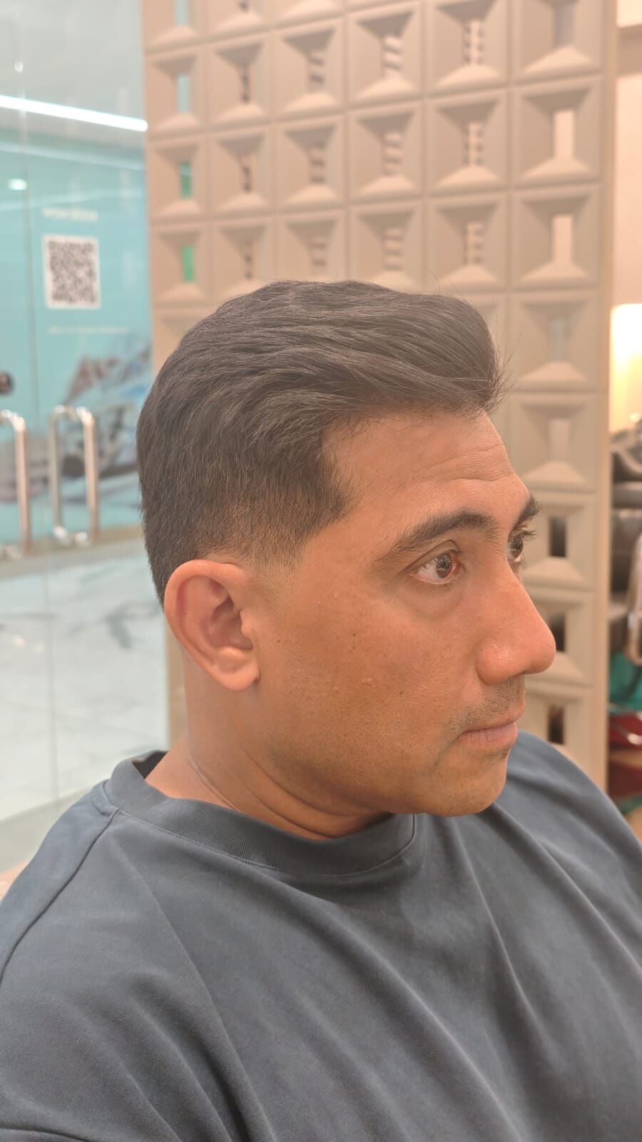 Client with a textured crop and skin fade at His &amp; Her Hairloft