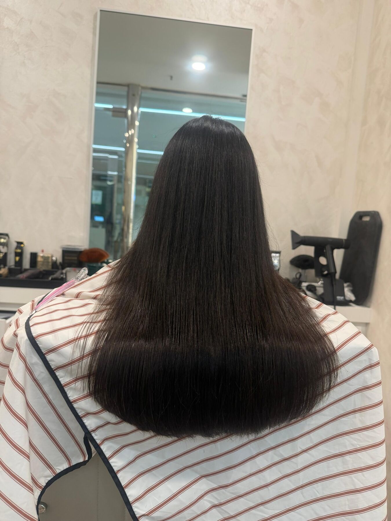 Long, smooth dark hair after keratin at the loft
